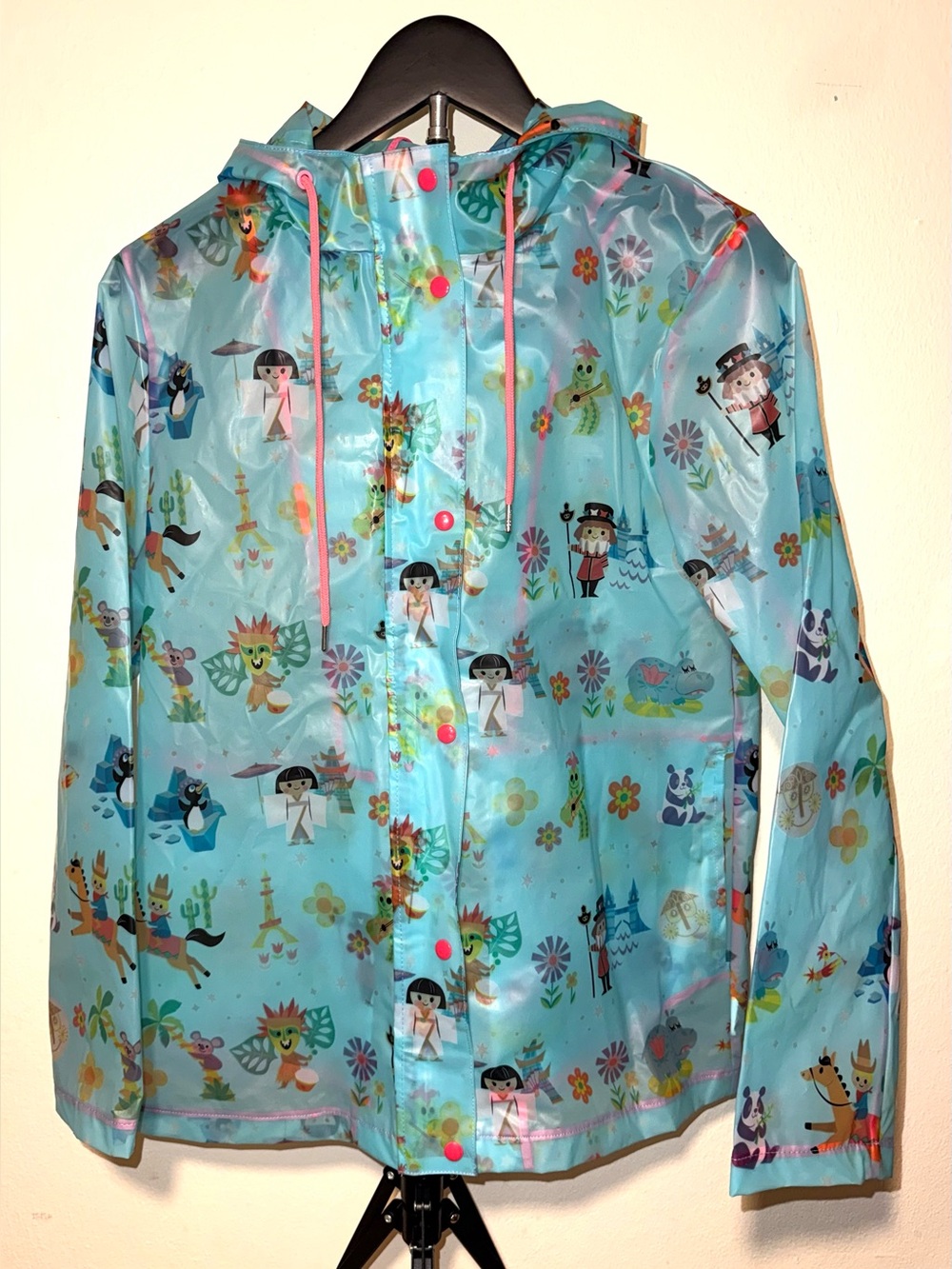 Disney Parks translucent blue “It’s a Small World” Raincoat, size S, EUC